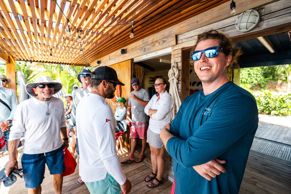 Crews sharing laughs at a beach bar between races